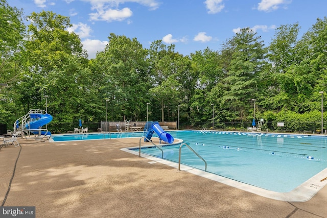 7879 Wintercress Ln, Springfield, VA 22152 - community pool featuring a water slide and a patio