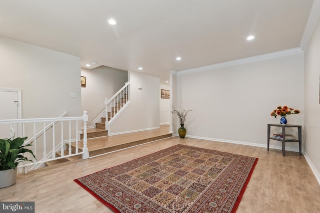 7879 Wintercress Ln, Springfield, VA 22152 - living area featuring wood finished floors, recessed lighting, ornamental molding, stairs, and baseboards