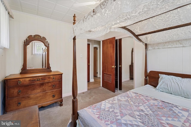 bedroom featuring carpet and baseboards