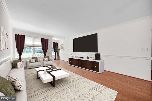 living area featuring crown molding, wood finished floors, and baseboards