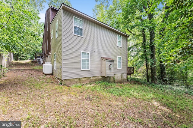 rear view of property featuring a chimney