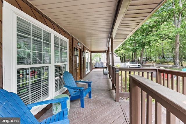 wooden deck featuring covered porch