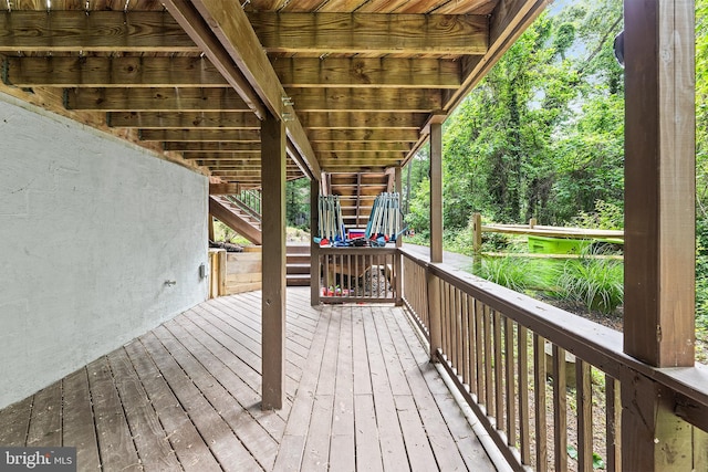 wooden deck featuring stairs