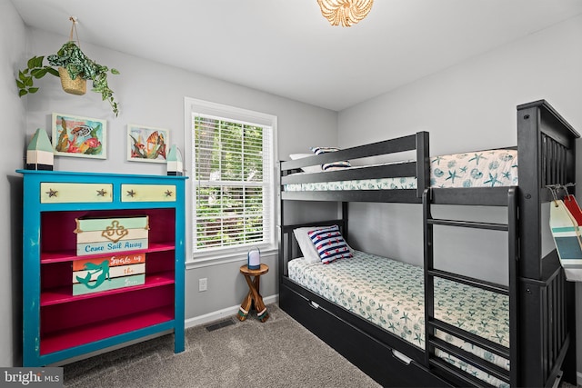 carpeted bedroom featuring baseboards