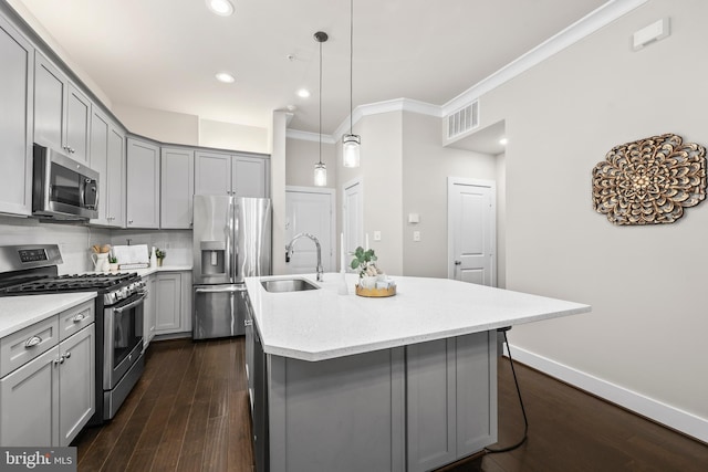 1334 S Quinn St, Arlington, VA 22204 - kitchen featuring stainless steel appliances, gray cabinetry, a sink, dark wood-style floors, and crown molding