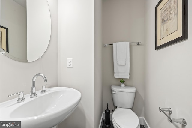 1334 S Quinn St, Arlington, VA 22204 - bathroom with a sink, toilet, and baseboards