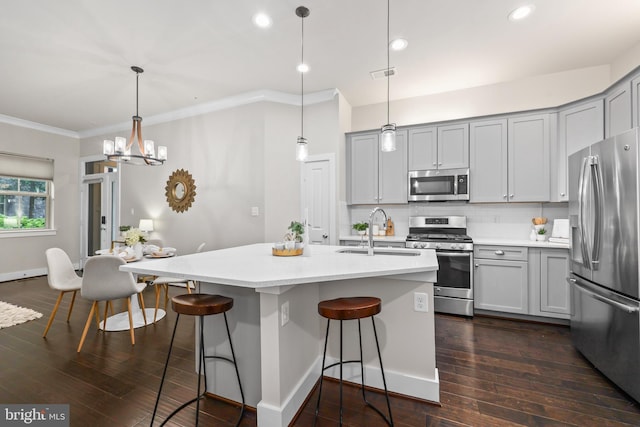 1334 S Quinn St, Arlington, VA 22204 - kitchen with stainless steel appliances, a sink, gray cabinets, ornamental molding, and decorative backsplash