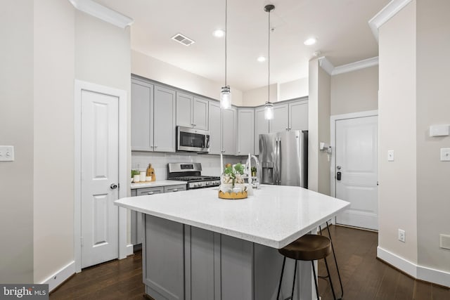 1334 S Quinn St, Arlington, VA 22204 - kitchen featuring stainless steel appliances, gray cabinetry, dark wood-style flooring, tasteful backsplash, and light stone counters