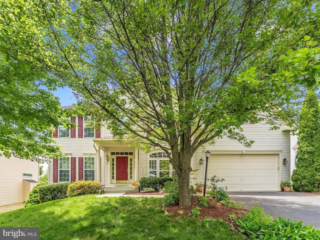 109 Galyn Dr, Brunswick, MD 21758 - view of front of house featuring driveway, a front lawn, and a garage