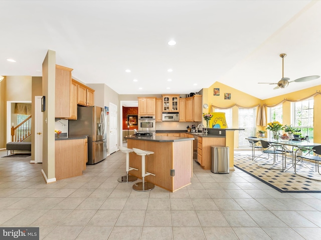 109 Galyn Dr, Brunswick, MD 21758 - kitchen with stainless steel appliances, light tile patterned flooring, a sink, a kitchen island, and recessed lighting