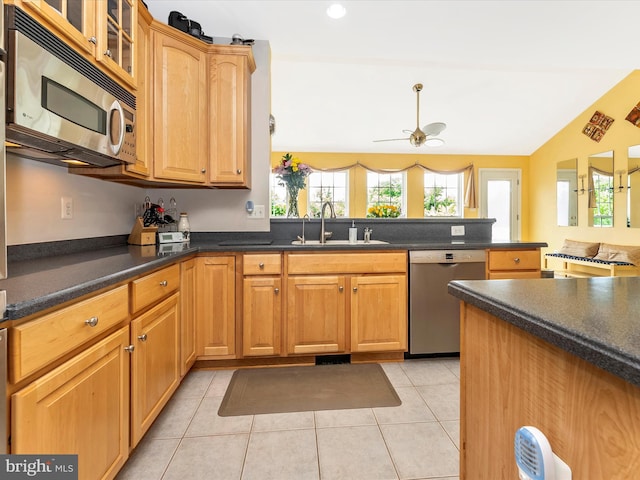 109 Galyn Dr, Brunswick, MD 21758 - kitchen with appliances with stainless steel finishes, dark countertops, a sink, ceiling fan, and light tile patterned floors