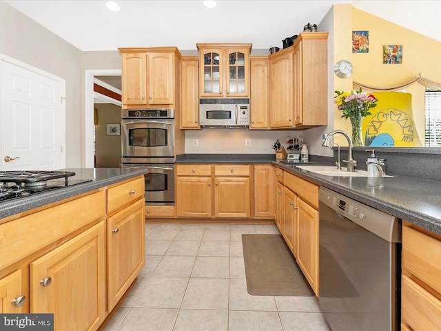 109 Galyn Dr, Brunswick, MD 21758 - kitchen with appliances with stainless steel finishes, a sink, dark countertops, light tile patterned floors, and glass insert cabinets