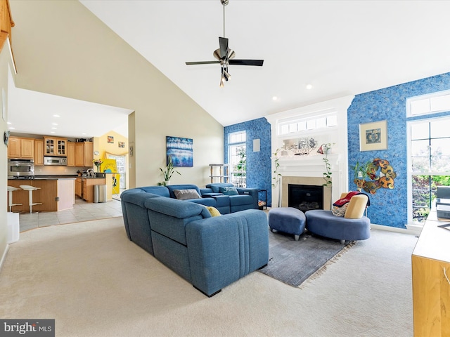 109 Galyn Dr, Brunswick, MD 21758 - living room with light carpet, high vaulted ceiling, ceiling fan, baseboards, and a glass covered fireplace