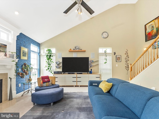 109 Galyn Dr, Brunswick, MD 21758 - carpeted living area featuring high vaulted ceiling, ceiling fan, a fireplace with flush hearth, stairs, and baseboards