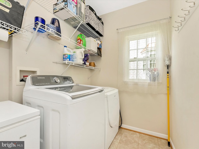 109 Galyn Dr, Brunswick, MD 21758 - washroom featuring washing machine and clothes dryer, baseboards, and light tile patterned floors