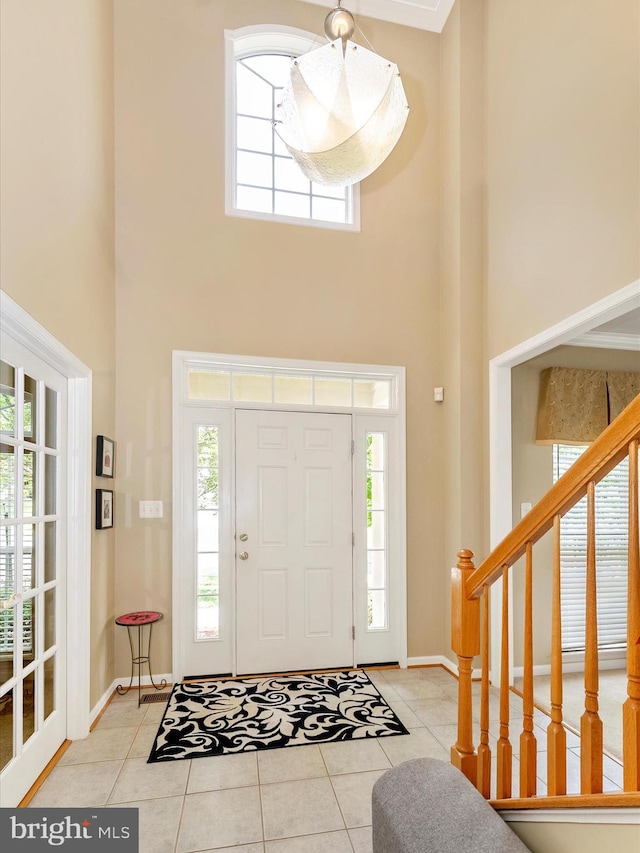 109 Galyn Dr, Brunswick, MD 21758 - foyer with a high ceiling, tile patterned floors, baseboards, and healthy amount of natural light