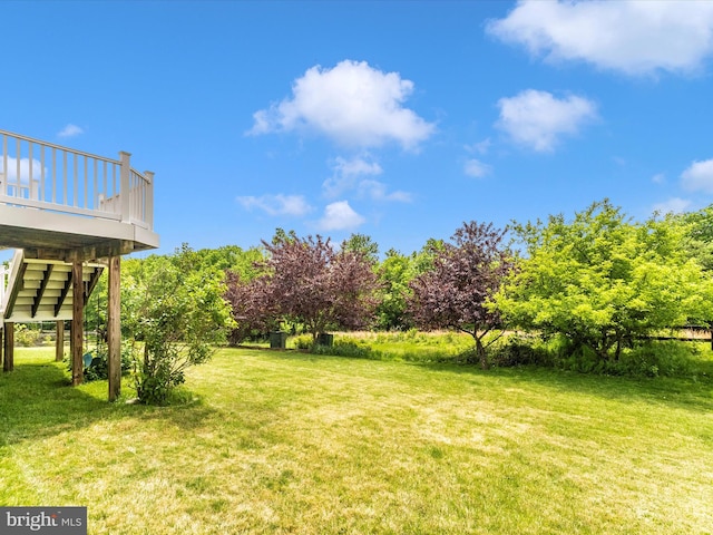 109 Galyn Dr, Brunswick, MD 21758 - view of grassy yard featuring a wooden deck and stairway