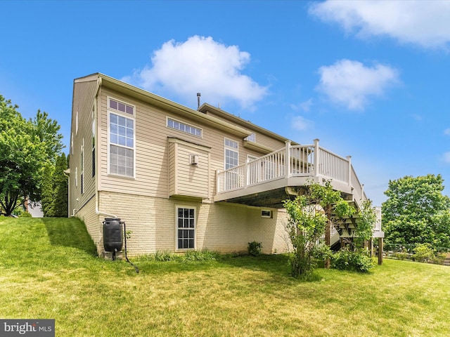 109 Galyn Dr, Brunswick, MD 21758 - back of property with a lawn, a wooden deck, and brick siding