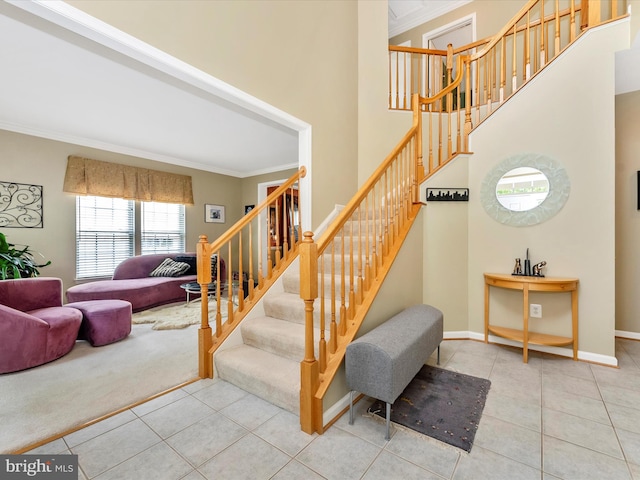 109 Galyn Dr, Brunswick, MD 21758 - stairway with ornamental molding, tile patterned flooring, baseboards, and a towering ceiling