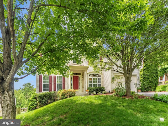 109 Galyn Dr, Brunswick, MD 21758 - view of property hidden behind natural elements with a front yard, a garage, and concrete driveway