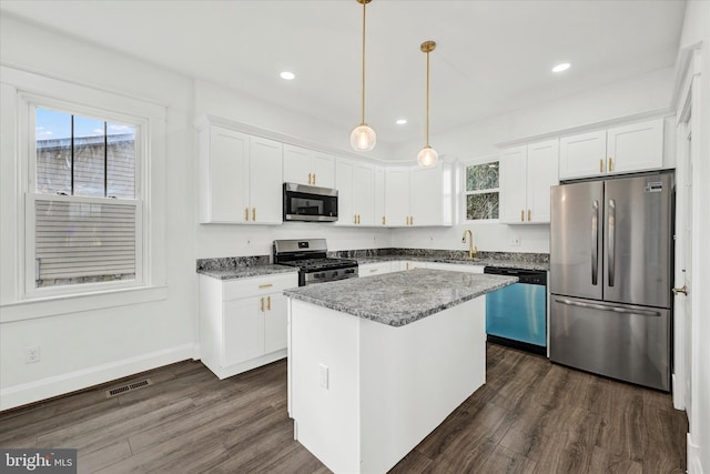 1127 Chesaco Ave, Rosedale, MD 21237 - kitchen featuring appliances with stainless steel finishes, a sink, healthy amount of natural light, white cabinetry, and recessed lighting