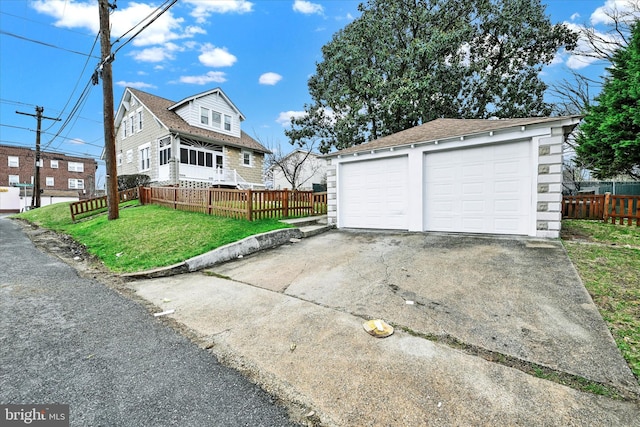 1127 Chesaco Ave, Rosedale, MD 21237 - view of front of property with an outbuilding, a detached garage, and a shingled roof