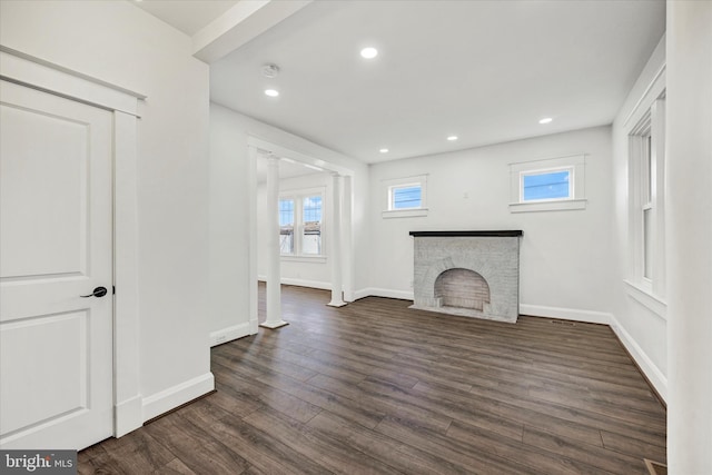 1127 Chesaco Ave, Rosedale, MD 21237 - unfurnished living room with dark wood-type flooring, baseboards, a stone fireplace, and recessed lighting