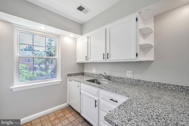 2101 N Taft St Unit 123, Arlington, VA 22201 - kitchen with dishwasher, open shelves, white cabinets, and light stone counters