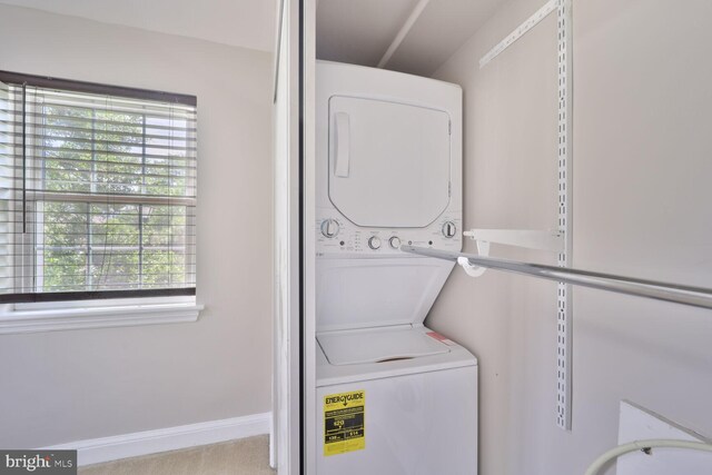 2101 N Taft St Unit 123, Arlington, VA 22201 - laundry room featuring stacked washing machine and dryer and plenty of natural light