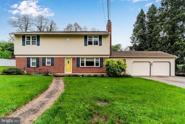 115 Diller Rd, New Cumberland, PA 17070 - colonial inspired home with a chimney, an attached garage, brick siding, and driveway
