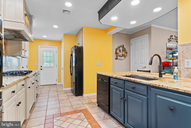 115 Diller Rd, New Cumberland, PA 17070 - kitchen with black appliances, a sink, blue cabinets, light tile patterned floors, and backsplash