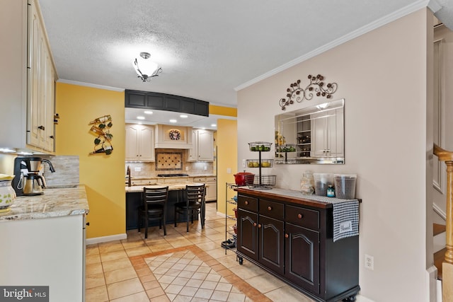 115 Diller Rd, New Cumberland, PA 17070 - kitchen featuring light tile patterned flooring, backsplash, a kitchen bar, crown molding, and baseboards