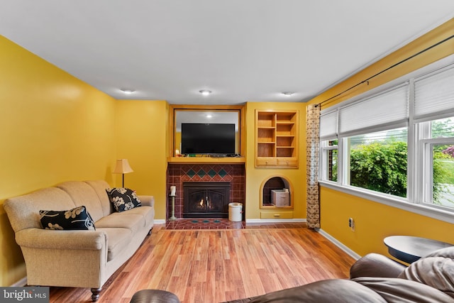 115 Diller Rd, New Cumberland, PA 17070 - living area featuring wood finished floors, a fireplace, baseboards, and built in shelves