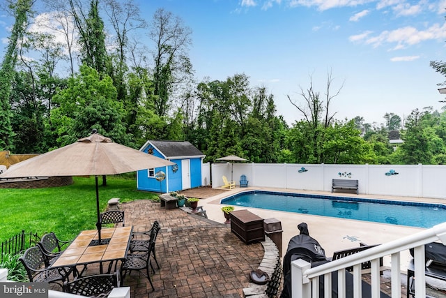 115 Diller Rd, New Cumberland, PA 17070 - view of swimming pool featuring a patio, an outdoor structure, outdoor dining space, a shed, and view of scattered trees