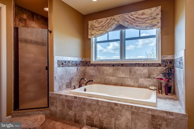 full bath with a shower stall and a bath