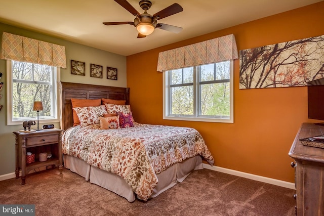 carpeted bedroom with baseboards and ceiling fan