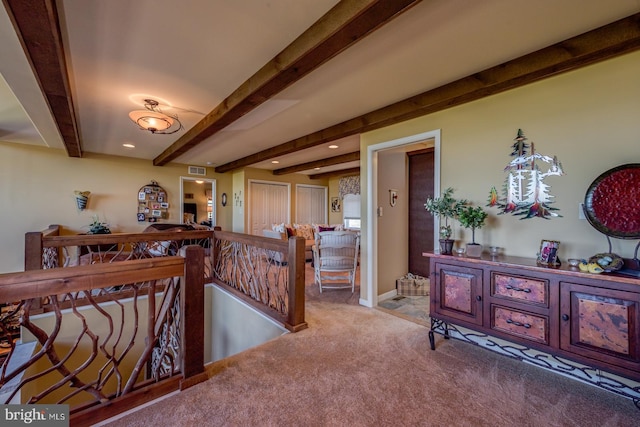corridor featuring an upstairs landing, beamed ceiling, carpet, recessed lighting, and baseboards