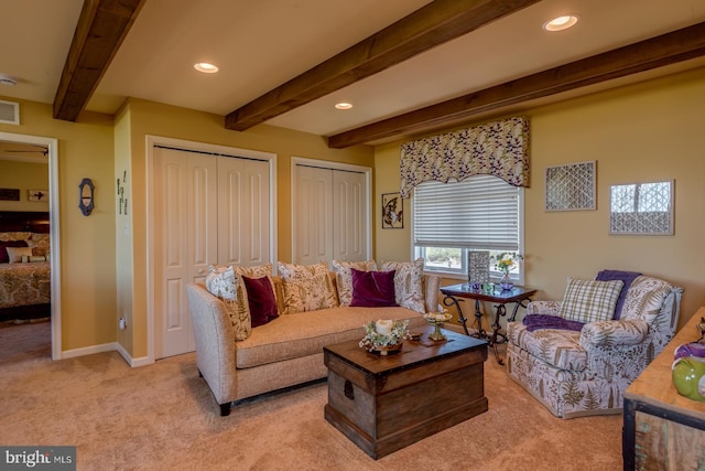 living area with light carpet, beam ceiling, recessed lighting, and baseboards