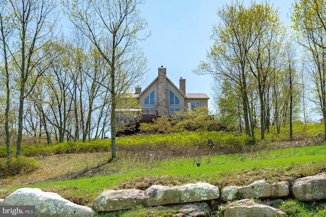 view of side of property with a chimney