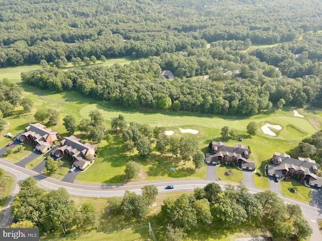 bird's eye view of a forest and a local golf course
