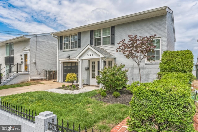 2425 Skyland Pl SE, Washington, DC 20020 - view of front of property featuring driveway, a garage, and fence