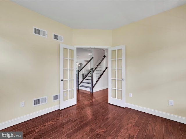 226 Crimson Ln, Elizabethtown, PA 17022 - empty room featuring french doors, baseboards, dark wood-style flooring, and stairway