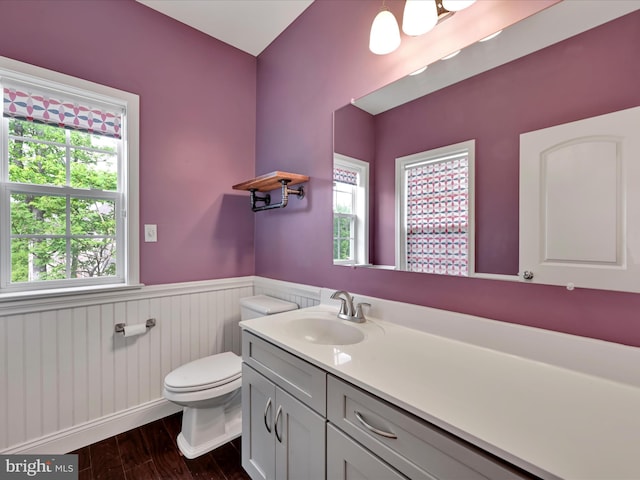 226 Crimson Ln, Elizabethtown, PA 17022 - bathroom featuring a wainscoted wall, wood finished floors, toilet, and vanity