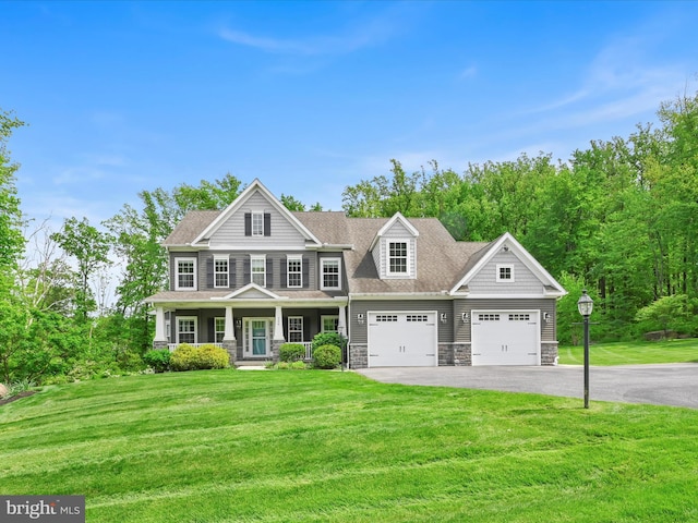226 Crimson Ln, Elizabethtown, PA 17022 - view of front facade featuring a porch, asphalt driveway, stone siding, an attached garage, and a front yard