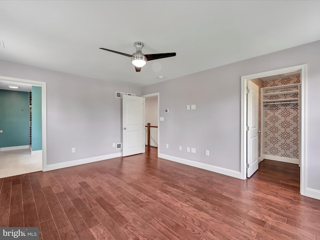 226 Crimson Ln, Elizabethtown, PA 17022 - unfurnished bedroom featuring wood finished floors, baseboards, a spacious closet, ensuite bathroom, and a ceiling fan