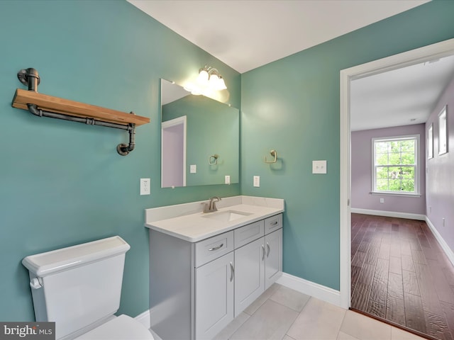 226 Crimson Ln, Elizabethtown, PA 17022 - bathroom with toilet, baseboards, and vanity