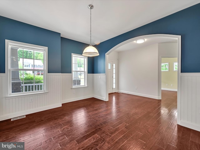 226 Crimson Ln, Elizabethtown, PA 17022 - spare room featuring a wainscoted wall, arched walkways, wood finished floors, and healthy amount of natural light