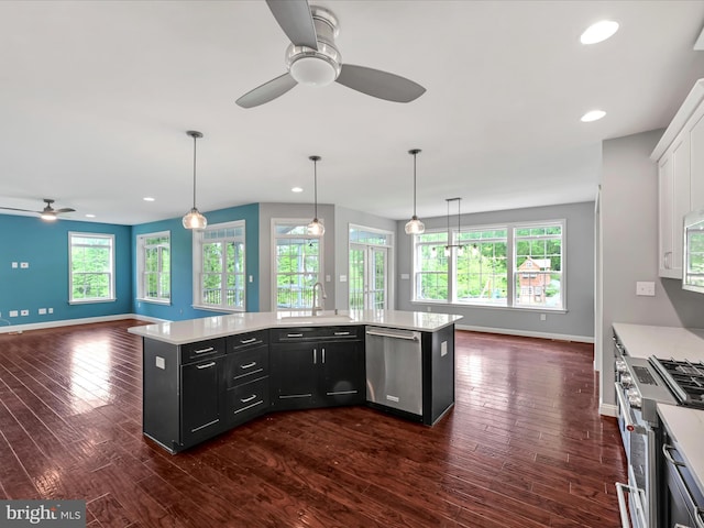 226 Crimson Ln, Elizabethtown, PA 17022 - kitchen with stainless steel appliances, a ceiling fan, dark cabinets, open floor plan, and light countertops