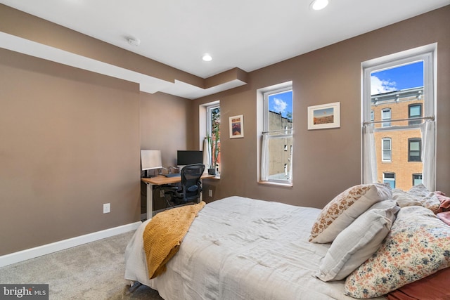 carpeted bedroom featuring baseboards, recessed lighting, and an office area