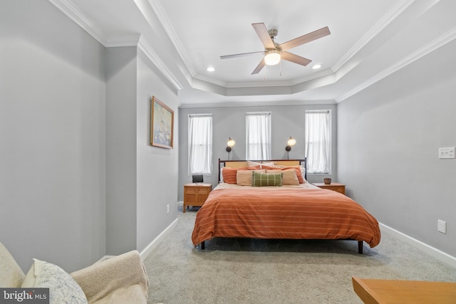 carpeted bedroom with ornamental molding, baseboards, a raised ceiling, a ceiling fan, and recessed lighting